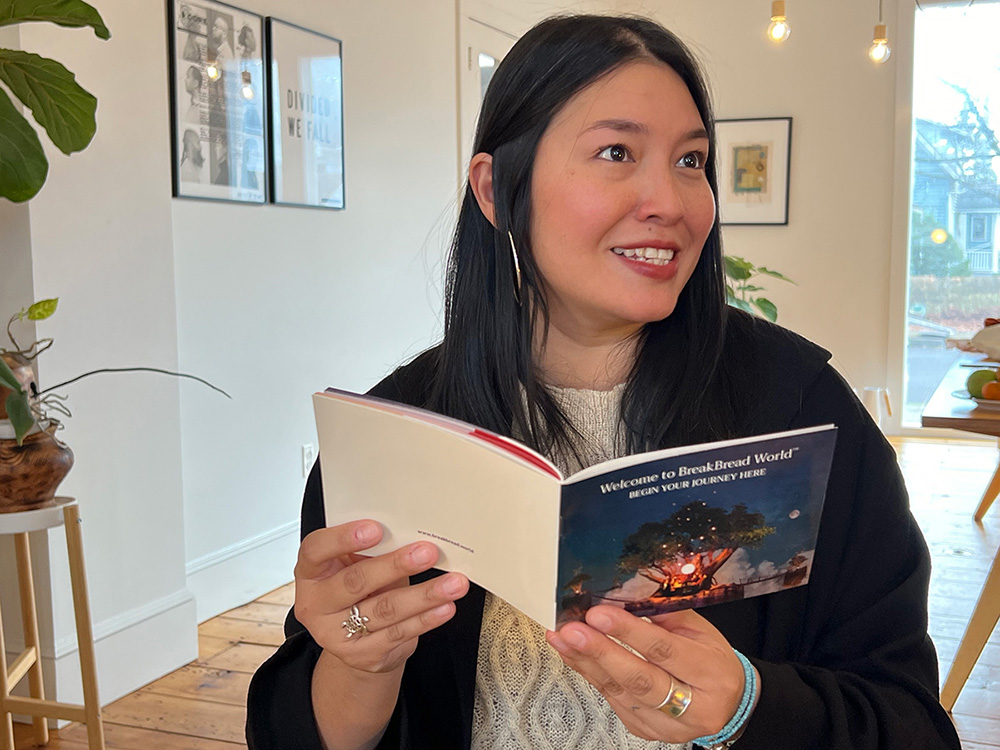 woman reading BreakBread World Journey booklet