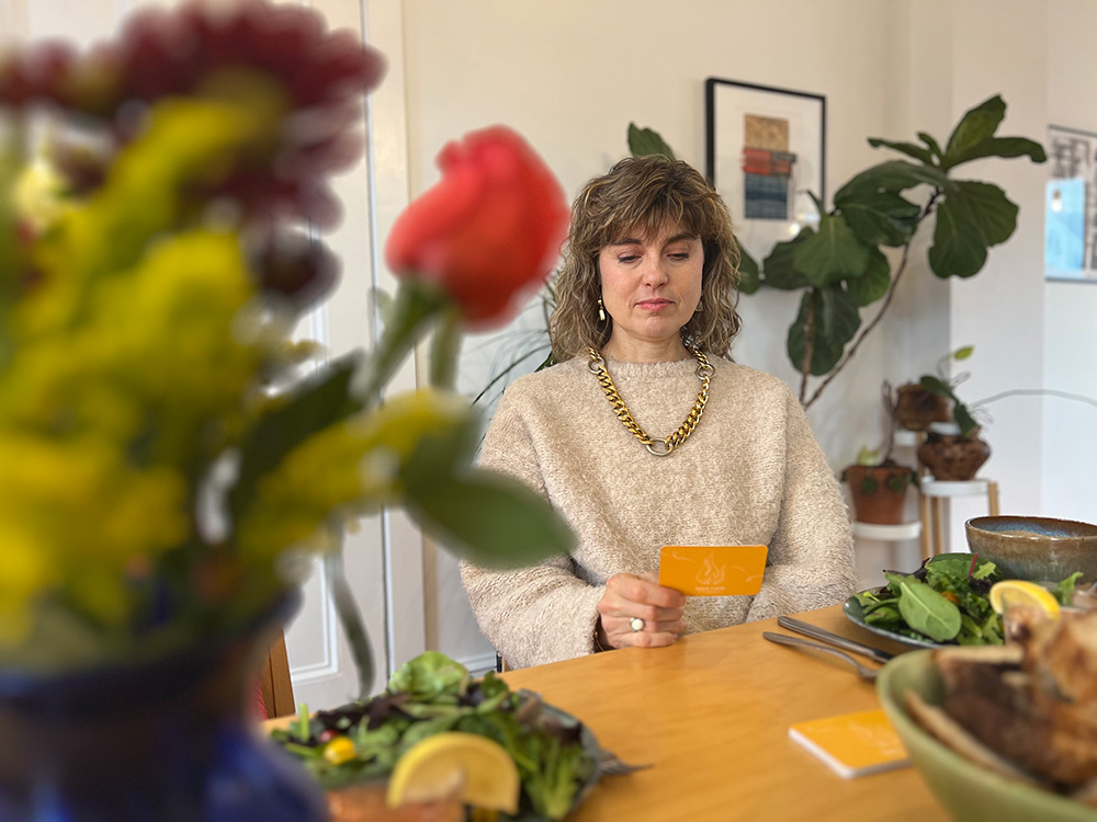 Woman looking at a BreakBread Spark Card