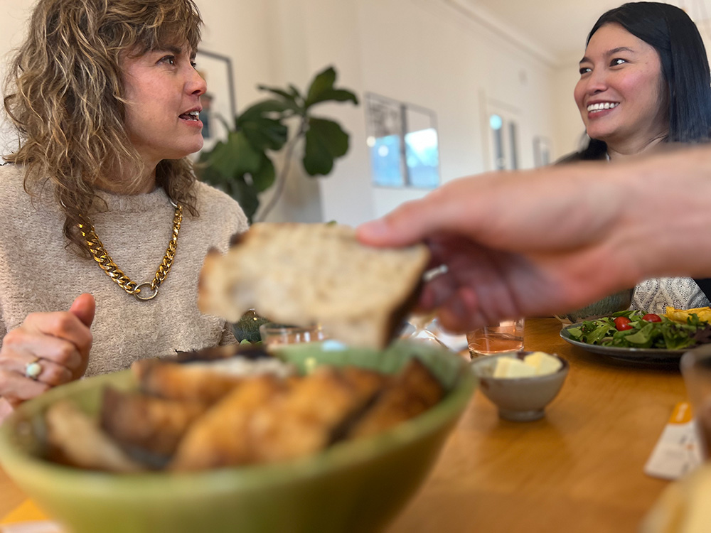 Two women in conversation at BreakBread Dinner