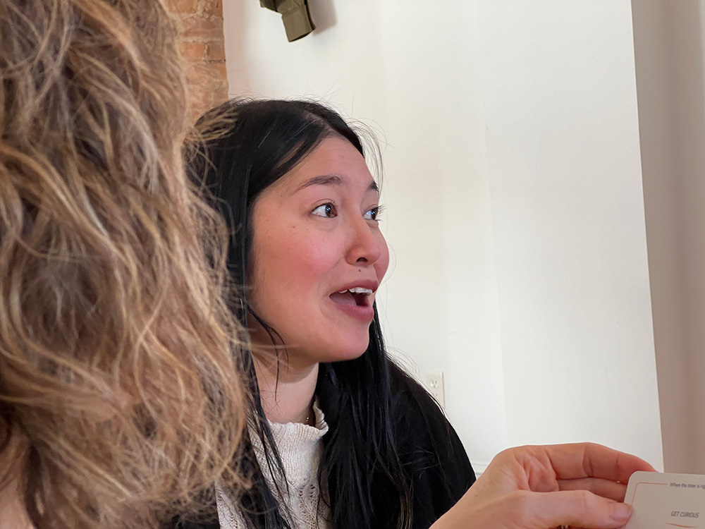 woman talking at a BreakBread dinner